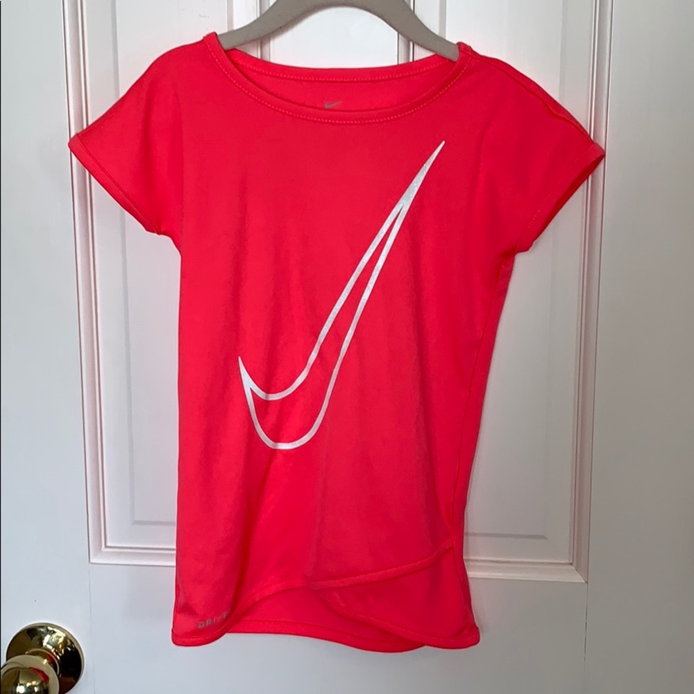 Hot pink Nike shirt with glittery Nike swoosh